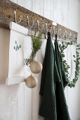 Christmas decorations hung from coat rack