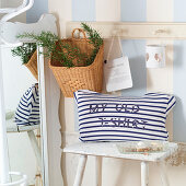 Maritime cushions with lettering made from old, blue-and-white striped T-shirt