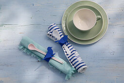 Handmade paper napkin rings with blue bird motifs