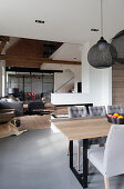Grey and white, open-plan interior in modern, country-house style