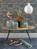Vases with covers made from floral paper in front of vintage-style floral wallpaper