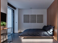 Floating bed in minimalist bedroom