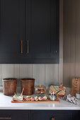 Dark kitchen cabinets with quartz worksurface