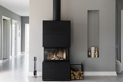 Wood-burning stove against grey wall