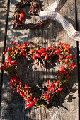 Heart wreath made of rose hips and twigs