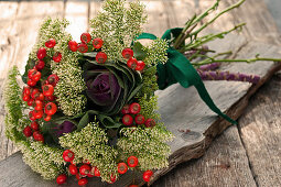 Bouquet of trachelium, rose hips and ornamental cabbage