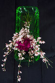 Modern bouquet of carnations and pink broom