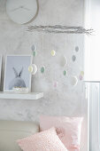 DIY Easter mobile decorated with pastel-coloured eggs