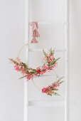 DIY spring wreath made from wooden hoops and dried flowers