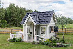 Scandinavian style playhouse in the garden