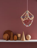 A DIY hanging lamp made from wooden beads