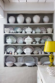 Shelves of white tableware