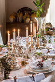 Festively set Christmas table with mercury candlesticks
