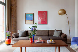 Sofa, standard lamp, coffee table and floor vase in living room