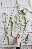 White spring flowers: tulip, anemone, willow catkins, waxflower, hyacinth, star-of-Bethlehem and cherry branch