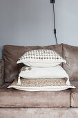 Scatter cushions on sand-coloured sofa