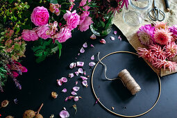 Metal ring, rose petals and dahlias for wreath making