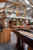 Open, eclectic living room with a lofted seating area