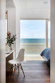 Minimalist bedroom with sea view