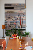 View over dining table to tapestry and dreamcatchers