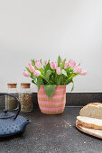 Pink tulips in a basket