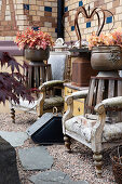 Junk, furniture, and objects as decoration along the garden path