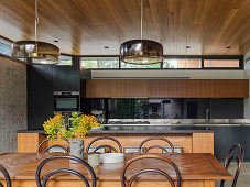 Open kitchen with a kitchen island and dining area