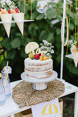Naked cake and snack bags in the garden