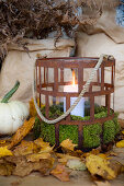 Rusty storm lantern on an autumn porch