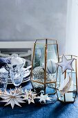 Decorative vases with Christmas tree baubles and star-shaped fairy lights