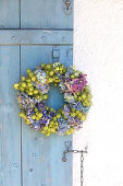 Wreath of hydrangeas and maidenhair on old shutters