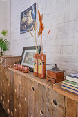 Decorative objects on a rustic wooden radiator cover