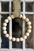 DIY wall wreath made from wooden balls