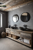 Recycled wood sink base with two counter top sinks in bathroom with grey walls