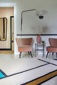 Vintage velvet armchairs in dusky pink, side table and lamp