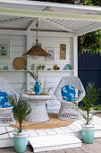 Gazebo with white lacquered vintage wicker furniture