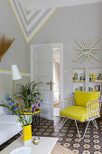 Classic armchair with yellow canvas cover in the conservatory