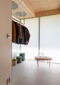 Wardrobe with insulating glass wall and concrete floor