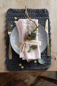 Christmas place setting with eucalyptus branch