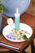 Candle holder decorated with hyacinth blossoms