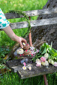 Mini bundt cakes and bouquet of tulips on garden bench