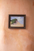 Small painting with landscape motif on clay wall