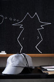 Chalkboard with detective motif
