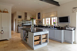 Kitchen area with center kitchen island in a converted barn