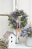 Meadow flower wreath and bouquet of bee's friend, grasses and shepherd's purse
