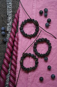 Small sloe berry wreaths to decorate presents, fabric dyed in sloe juice