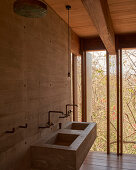 Bathroom with concrete washbasin and view of nature, Casa Cometa, Mexico