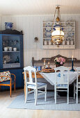 Scandinavian-style dining area with traditional pastries and candlesticks