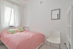 Minimalist bedroom in shades of pink and white
