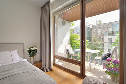 Bedroom with balcony access and outdoor seating area